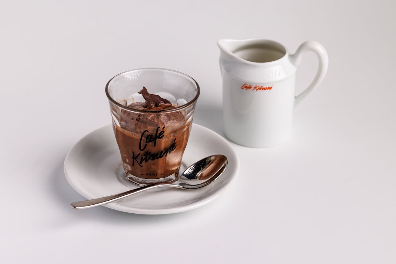 Elegant dessert and cream setup at Café Kitsuné, perfect for gourmet enthusiasts.